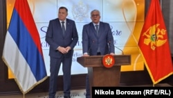 Montenegrin parliament speaker Andrija Mandic (right) welcomes Bosnian Serb leader Milorad Dodik to Podgorica on February 27. 