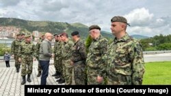 Serbian Defense Minister Milos Vucevic with members of the Serbian Army in May
