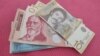 Officials in Kosovo say they are looking at several options in implementing a controversial decision to restrict all cash transactions anywhere in the country to euros from February 1, but that a delay in the measure is not being discussed.
