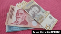 Officials in Kosovo say they are looking at several options in implementing a controversial decision to restrict all cash transactions anywhere in the country to euros from February 1, but that a delay in the measure is not being discussed.