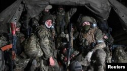 Fighters with the Wagner private mercenary group pull out of the Russian city of Rostov-on-Don on June 24 following their abortive mutiny the previous day. 