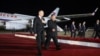 Russian President Vladimir Putin (left) and North Korean leader Kim Jong Un walk at the Pyongyang Sunan International Airport outside Pyongyang early on June 19.