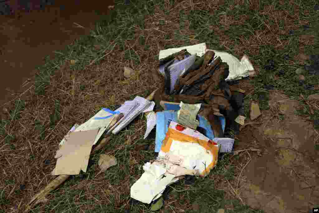 Children's waterlogged schoolbooks The flash floods have partially or completely damaged 606 residential houses, as well as hundreds of acres of farmland, Rahimi said.