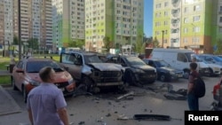 A damaged car is seen in a parking spot following a blast that reportedly injured an officer from Russia's GRU military intelligence, in Moscow on July 24.
