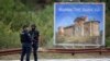 Kosovar police officers secure a road leading to the monastery in the village of Banjska on September 24. 
