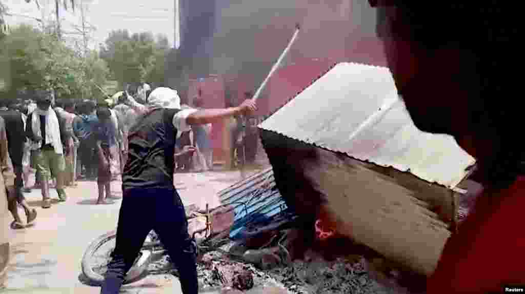 Furniture and other belongings of a church are set on fire in Jaranwala on August 16.