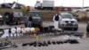 Kosovar police display weapons after an attack on a monastery in the north of the country. 