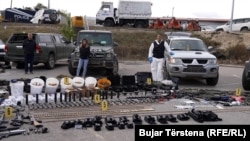 Kosovar police display weapons after an attack on a monastery in the north of the country. 