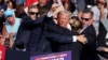 Donald Trump pumps his fist after a failed attempt on his life during a rally in Pennsylvania on July 13. 