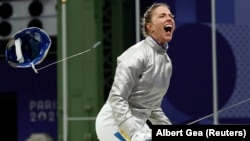 Olha Kharlan of Ukraine celebrates after winning her bout on July 29. 