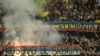 Romanian fans display banners reading (in Serbian) "Kosovo is Serbia" and (in Romanian) "Bessarabia is Romania" during the EURO 2024 qualifying match between Romania and Kosovo in Bucharest on September 12.