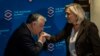Hungarian Prime Minister Viktor Orban (left) and French National Rally (RN) leader Marine Le Pen attend a 2021 meeting in Warsaw.