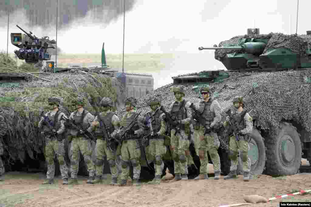German troops during a NATO exercise in Lithuania in 2024. Today, NATO has 32 member states across Europe and North America. Amid the Russian invasion of Ukraine, individual NATO members have supplied tens of billions of dollars worth of weaponry to Kyiv but the alliance has not directly intervened. NATO has called the Russian invasion a “brutal and unprovoked war of aggression against Ukraine,” and has vowed to eventually include Ukraine in the alliance. 