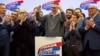 Serbian President Aleksandar Vucic celebrates on stage at the Serbian Progressive Party (SNS) headquarters following exit-poll results of the parliamentary elections in Belgrade on December 17.