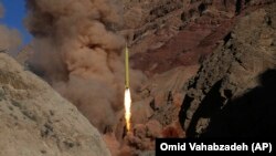  An Iranian Qadr H long-range ballistic surface-to-surface missile is fired during a training maneuver by Iran's Islamic Revolutionary Guards Corps. (file photo
