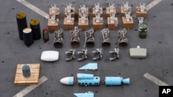 Photograph released by the U.S. military's Central Command show what are described as Iranian-made missile components bound for Yemen's Huthi rebels after the seizure of a vessel in the Arabian Sea. (file photo)