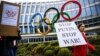 Protesters outside the IOC's headquarters in Lausanne demand the exclusion of Russian athletes from next summer's Olympic Games in Paris. (file photo)