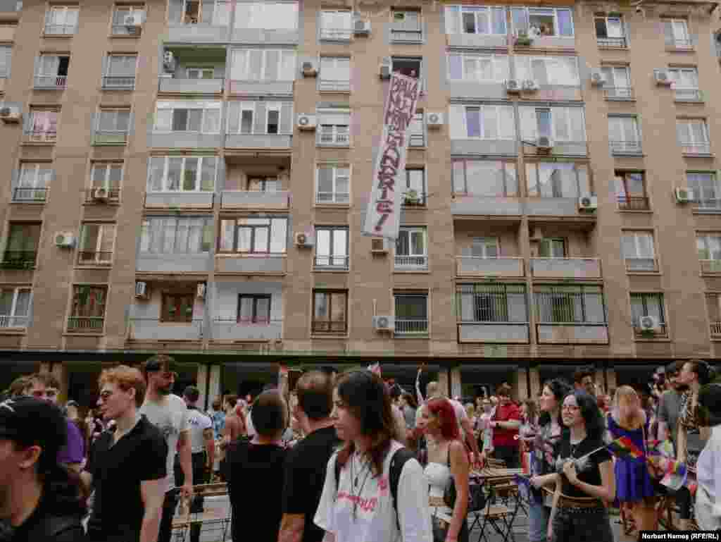 A protest banner with the slogan "Illness Is Not A Reason For Pride!" hangs from a residential area along the route. A survey commissioned by ACCEPT in 2021 showed that only 43 percent of Romanians were in favor of legal recognition of civil marriage for same-sex couples.