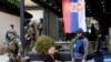 Kosovar police officers search a restaurant and building in a Serb-dominated part of the ethnically divided northern town of Mitrovica on September 29.