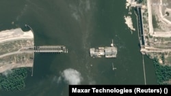 A satellite image of the Kakhovka dam after it was breached.