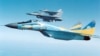 A Ukrainian MiG-29 flies next to American F-16 fighter jets. (file photo)
