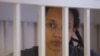 U.S. basketball player Brittney Griner stands inside a defendants' cage during the reading of the court's verdict in Khimki outside Moscow in August.