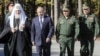 Глава РПЦ Кирило, президент Росії Володимир Путін, міністр оборони РФ Сергій Шойгу і начальник Генштабу ЗС РФ Валерій Герасимов (зліва направо) під час закладення каменю в фундамент головного храму армії Росії. Московська область, 19 вересня 2018 року