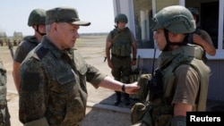 A screenshot from a video released by Russia's Defense Ministry on July 8, showing Sergei Shoigu purportedly inspecting troops in his country's Southern Military District. 