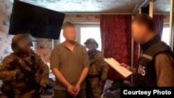 A photo on the KNB's website purports to show the arrest of the "foreign intelligence agent."
