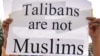 Activists protest against the Taliban militants in Lahore on April 28.