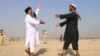 People greet each other after offering Eid al-Adha prayers in Jalalabad, Afghanistan, on September 1.