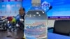 A potentially toxic aconite infusion is seen at a press conference in Bishkek on April 16.