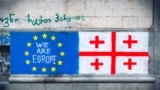 Tbilisi, Georgia - 16th may, 2024: Eu and Georgian flag on wall,
