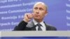 Russian Prime Minister Vladimir Putin talks to reporters after a meeting with European Commission President Jose Manuel Barroso in Brussels on February 24.