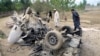 FILE: Security officials inspect the site of a bomb attack in Bajaur tribal region.