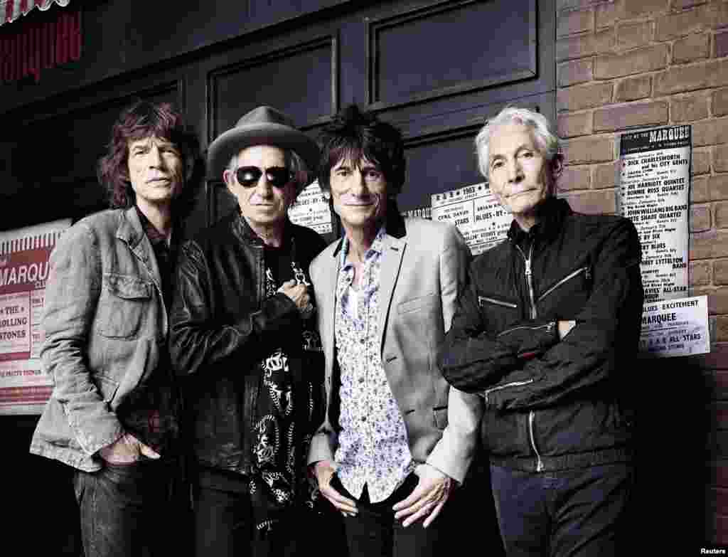The Rolling Stones pose in front of London's Marquee Club -- the scene of their first live gig -- on July 11, 2012.