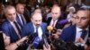 Prime Minister Nikol Pashinian talks to reporters in Yerevan on October 1.