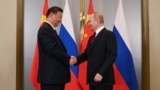 Си Цзиньпин и Владимир Путин на саммите ШОС в Астане в 2024 году