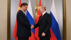 Си Цзиньпин и Владимир Путин на саммите ШОС в Астане в 2024 году