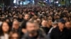 People take part in an opposition march in Belgrade on December 25. 