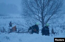 Rescue workers at the crash site