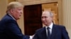 U.S. President Donald Trump and Russian President Vladimir Putin shake hands following a joint news conference at the Presidential Palace in Helsinki in 2018.