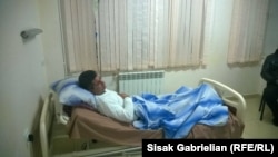 Armenia -- Opposition activist Ashot Piliposian lies in a hospital bed after being attacked in Hrazdan, 12Dec2014