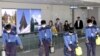 Health officials disinfect the passenger terminal at Incheon International Airport in Seoul on May 3, 2009