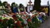 A mourner lays flowers on the grave of Russian opposition leader Aleksei Navalny at the Borisovo cemetery in Moscow on March 2.