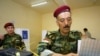 Kurdish peshmerga militia officers vote in Irbil. With a third of the seats, the opposition in the region has challenged the duopoly of the two ruling parties.