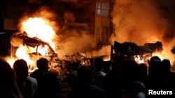 Fires burn during unrest in the Harehills district of Leeds on July 18. 