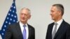U.S. Secretary for Defense Jim Mattis (L) speaks with NATO Secretary-General Jens Stoltenberg prior to a meeting at NATO headquarters in Brussels on June 29.