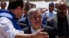 United Nations Secretary-General Antonio Guterres (center) visits a camp for internally displaced people outside Kabul on June 14.