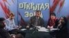 Фрагмент видеозаписи программы «Открытая зона» в прямом эфире на телеканале ТВ «М». В центре — ведущий программы Сергей Дуванов. Алматы, 20 ноября 1996 года.